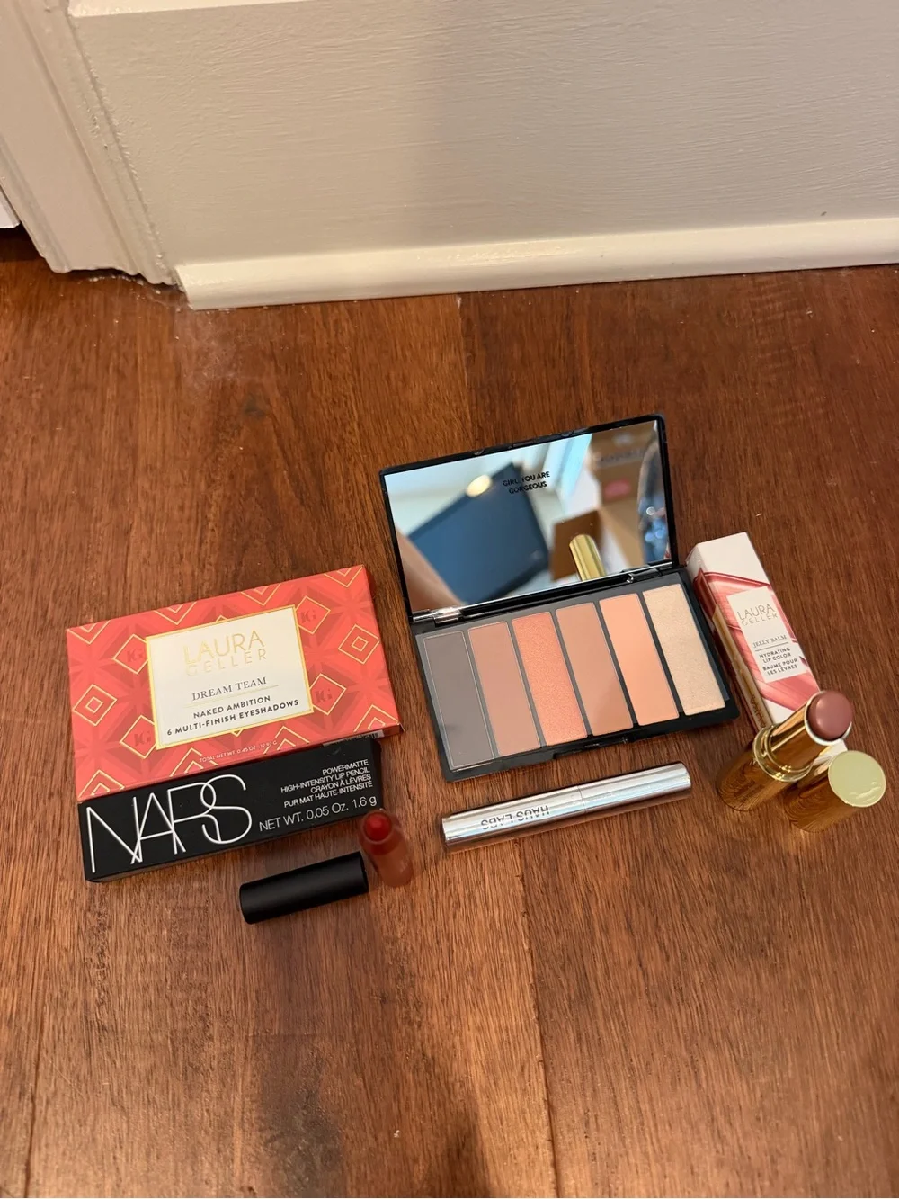 Laura Geller shadow palette, nars lip, Laura Geller gloss, haus mascara